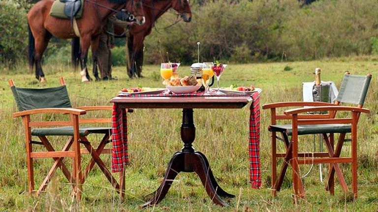 Guests can reserve a bush breakfast or dinner on the edge of the property, reached by a walk or a short horseback ride. // © 2016 Fairmont Mount Kenya Safari Club