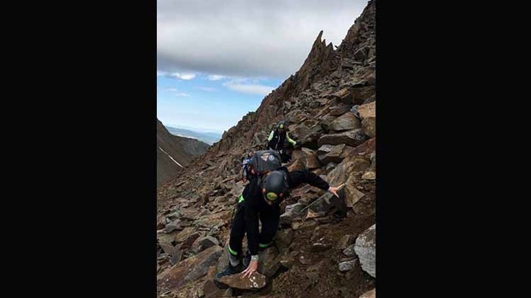 Hiking Wilson Peak requires some scrambling over loose rocks. // © 2017 Meg Spenchian