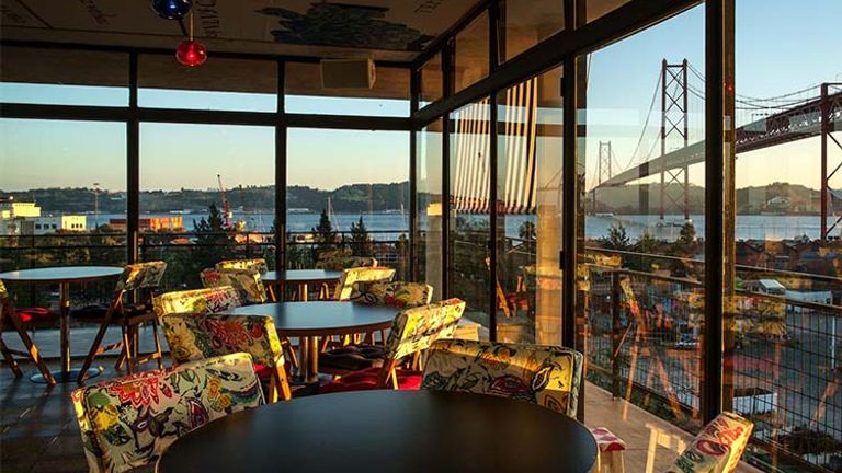 Order Brazilian-Portuguese-fusion tapas at LX Factory’s Rio Maravila while taking in a view of the nearby bridge and river. // © 2018 Rio Maravila